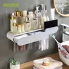 Ecoco Toothbrush Holder Magnetic Adsorption Cup Rack自動歯磨き粉スクイザーディスペンサーウォールマウントバスルームアクセサリー240228