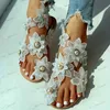 Sandaler Womens Flowers Flat Sandaler Kvinnor tofflor Fashion Toe Loop Faux Pearl Slip On Shoes Casual Beach Travel Sandaler T240302