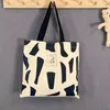 Mode toile sacs classique un sac à bandoulière grande capacité étudiant femme classe Art sac à main fourre-tout décontracté