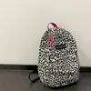 Schulbeutel Frauen Leinwand Zebra Kuhmuster Druck Rucksack Preppy Damen große Handtaschen wasserdichte Campus Reise Rucksack