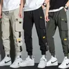 Pantaloni casual da uomo streetwear sottili Nastri da uomo Pantaloni da jogging Harem Pantaloni cargo da uomo slim fit primaverili Pantaloni multi-tasche da donna Jx1 240228