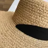 STRÅD KVINNER Bred BRIM SUN Protection Beach Hat Black and White Ribbon Bowknot Straw Cap Casual Ladies Flat Top Panama Hat 240219