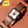 22% de descuento en reloj Reloj Kou Jia flor de camelia de tres colores Chi piel de vaca cuadrado pequeño chicas de azúcar moda banda de acero de cuarzo Camellia Flower Square