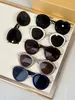 Hommes lunettes De soleil pour femmes dernière vente mode lunettes De soleil hommes lunettes De soleil Gafas De Sol verre UV400 lentille 40130U