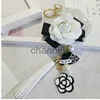 Key Rings Famous Keyring Black White Leather Camellia Flower Keychain Women Flower Key Chains llaveros flore Bag Charms 240303