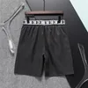 Verão nova moda masculina designer shorts de secagem rápida roupa de banho impressa calças de praia shorts de natação masculino marca luxo solto moda casual calças 06