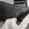 Titular de la tarjeta de crédito para hombres Cartera de dólar Carteras de libra Diseñador Tamaño pequeño Caja original Hardware de moda Bolsillo plegable Monedero Cuero Cuero de vaca con caja