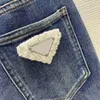 Designer de jeans pour femmes en jeans femmes vêtements de marque dames fashion haute taille et pantalon stretch slim décoré avec triangle marc 21 déc. Nouveau 240304