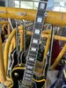 Custom electric guitar, black casting, yellow logo and body binding, gold accessories, lightning bag