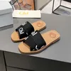 Pantoufles de créateurs classiques Woodys sandales tissu toile lettres marque de luxe diapositives sandales plates à la mode à la mode à bout ouvert en plein air maison pantoufles de plage