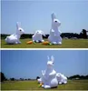 عملاق بالجملة 6MH (20 قدمًا) مع منفاخ أرنب أرنب ، فإن نموذج أرنب عيد الفصح يغزو المساحات العامة في جميع أنحاء العالم مع ضوء LED