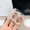 European And American Exaggerated And Atmospheric Wide Edition High-quality Light Luxury Buckle Pearl Women's Double Letter Resin Bracelet