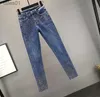 Jeans da donna taglie forti 4XL! Jeans alla moda con piedi diamantati jeans a matita con perforazione a caldo in vita primaverile 240304