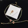 Bijoux de créateurs Boucle d'oreille Diamond Love Collier de perles Ruby Strass Boucles d'oreilles Chaîne en métal Pendentif Eardrop Bracelet en cristal Cadeau d'anniversaire