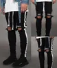 Jeans skinny strappati da uomo elasticizzati con fori per il ginocchio 2019 Pantaloni in denim a matita nera Designer Joggers a righe laterali in difficoltà7472136