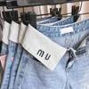 Women's Jeans new Womens Jeans Leg Low Rise Trousers Miu Roll Waist Letter Embroidery Designer Pants Women Look Thin and Cover Your Hips 240304