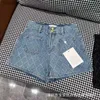 Damesjeans Jeans designerkwaliteit vroege lente nieuwe chique stijl jacquard ruitpatroon getailleerde denim shorts met dubbele knopen 89BA 240304