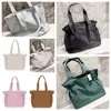 Desinger Lu Side Cinch Shopper Bag Yoga påse handväska saker säckar stor kapacitet multifunktionella fitnessbälten väska ryggsäck bälte väska