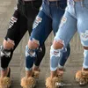 Jeans da donna Jeans alla moda Leggings in denim lavato con foro rotto Pantaloni lunghi primaverili Taglie forti 240304