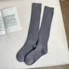 Femmes chaussettes couleur unie longue cuisse bas rayure conception absorbant la sueur Anti-fric élasticité femmes bas dames