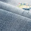 Jeans da uomo Ly Designer Moda Uomo Retro Blu chiaro Stretch Slim Fit Strappato Ricamo Patched Pantaloni in denim vintage Homme