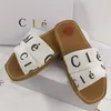 Designer slippers voor vrouwen houtachtige stoffen canvas letters merk dia's platte sandalen comfortabel trendy modieuze open tented buiten zandslipper