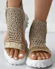 Casual skor sandaler kvinnor flätad geometrisk kil stickad elastisk sommarmask platt ihålig kvinnlig plattform