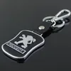 5pcs lot Top Fashion Car Keychain pour Peugeot Metal Le cuir en cuir clés de la chaîne de clés Llaveros Chaveiro Emblem Key Holder269s