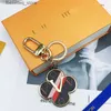 Nyckelringar designer nyckelring för kvinnor gyllene läder solros nyckelring med låda matchande bilhänge metall mode personlig creativel240305