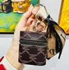 Llaveros 11 estilos Bolsa de lápiz labial Llaveros Letra Bufanda de seda Cadenas Anillo Diseño de moda Monedero de cuero de PU Estuche Colgante Llavero Joyas con dijes para hombres Mujeres Regalos