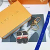 Nyckelringar designer nyckelring för kvinnor gyllene läder solros nyckelring med låda matchande bilhänge metall mode personlig creativel240305