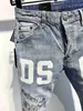 21s Mens jeans designer Ripped Skinny Trousers Moto biker hole Slim Fashion Brand Distressed ture Denim pants Hip hop Men D2 9809 dsu000fquared2d su000fquared2d u 00