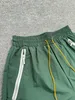 Rhude Mens Designer Shorts Summer Fashion Sports Beach عالية الجودة شارع الهيب هوب على غرار الولايات المتحدة متعدد الحجم S-XL 256H