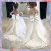 Schnelles Schiff DHL auf Lager Spitze Tüll Blumenmädchen Bögen zurück Mädchen Erste Kommunionkleider Prinzessin Ballkleid Hochzeitsfeier Kleid FS9780 s Prcess Weddg