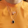 Diseño de nicho europeo y americano Sentido Temperamento Versátil Ágata negra Colgante de piedra manchada Cadena de clavícula Collar imprescindible para desplazamientos de moda