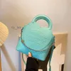 Diseñador Bolso para mujer INS Carta Cadena Un hombro Crossbody Tiffanyity Litchi Patrón Capacidad Bolso versátil 2024