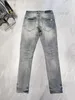 24ss Jeans viola da uomo Jeans firmati Moda motociclisti strappati in difficoltà Donna Denim cargo per uomo Pantaloni neri tendenza high street