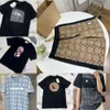 コーチシャツコーチショートメンズTシャツデザイナー女性S TシャツトレンディなカルダモンCグラフィックショーツサマーファッションコットンラウンドネックショートスリーブティーマン463