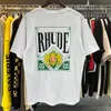 الأكمام القصيرة القمصان rhude للرجال مصممة النساء الفاخرة t قميص الجودة عالية الجودة الأزياء عارضة شورت رود الأكمام للجنسين رقبة الرقبة مضادة تجاعيد tshirts