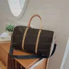 Top qualité hommes sac fourre-tout femmes sacs de voyage bagages à main sacs de voyage hommes sacs à main en cuir Pu grands sacs à bandoulière