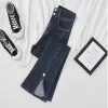 Jeans vintage a vita alta con doppio lato diviso con bottoni a cuore pantaloni in denim pantaloni coreani a zampa di denim elasticizzato pantaloni streetwear da donna