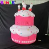 6mH (20ft) avec souffleur rose géant joyeux anniversaire décoration de gâteau gonflable avec bougie ballon de gâteau personnalisé pour la décoration de fête