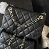 Designer des femmes Duma Black Blanc DrawString Backet Sac à dos sacs Calfskin Gold Metal Hardware Interwoven Sac à main