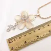 Kobiety łańcuch swetra Naszyjniki Wisianty Nowy biżuteria Rose Flower Cross Cat Eye Kamień Kamień Austriacki Kryształowy Moda Rhinestone Naszyjnik