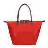 Stora röda väskor med stor kapacitet för kvinnor med en enda axel bärbar dumpling väska vikningsförvaringsväska handväska lyxväska