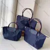 2024 Designer-Einkaufstasche, Damenhandtasche, Umhängetasche, europäische Freizeittasche, Knödeltasche, Nylon-Handtasche, Umhängetasche, Falttasche, bestickte Handtasche, Einkaufstasche, Rucksack