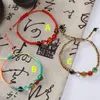 Bracciale in corda intrecciata a mano multicolore in stile cinese con perle di vetro in 5 colori per accessori di gioielli da spiaggia estivi da donna