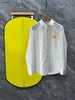Marque hommes chemise chemises de créateurs à manches longues maillot de corps mode vêtements pour hommes décontracté t-shirt solide bouton de revers pull fermé mars 06