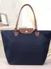 Nova moda simples e versátil grande capacidade bolsa de ombro mamãe bolsa feminina lazer viagem bolinho bolsa