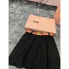 designer MM23 AutumnWinter New Fashion Metal Twist Button Decoration Style Academy Style Slim and Versatile Pleated Short Skirt S248